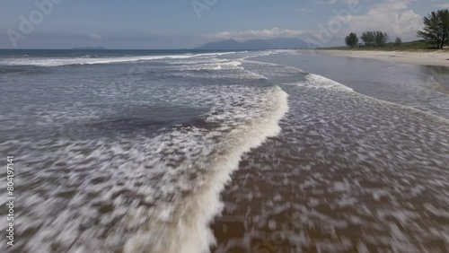 Deserted beach waves, ilha comprida, são paulo, brazil, aerial drone push in parallel 2 photo