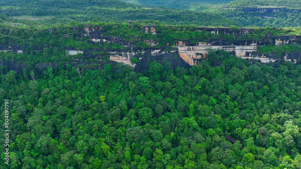 Pha Taem's stunning cliffs and ancient rock art come to life from a mesmerizing drone's perspective, revealing its timeless beauty. Pha Taem National Park, Ubon Ratchathani Province, Thailand.
