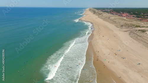 Hossegor beach and waves filmed with a drone flying along the coast photo