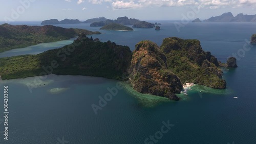 High altitude panning right to left over Cudugnon beach to view its connection to the mainland. photo