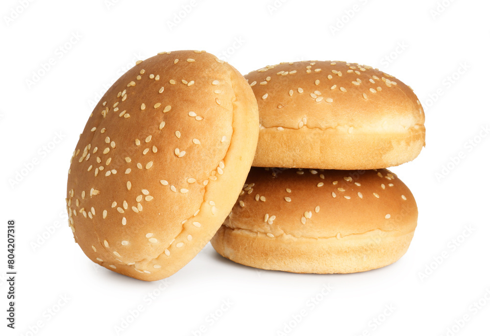 Three fresh burger buns isolated on white