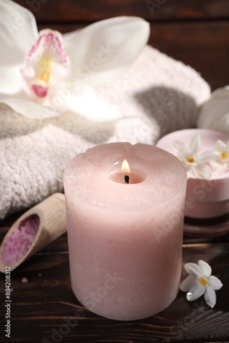 Composition with spa supplies and flowers on wooden table