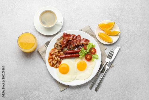 Delicious breakfast with sunny side up eggs on light table, flat lay