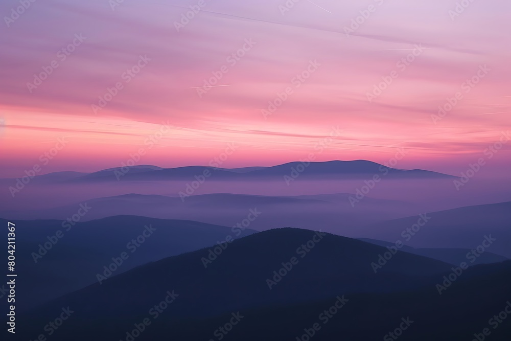 The smooth contour of a hill under a pastel sunset