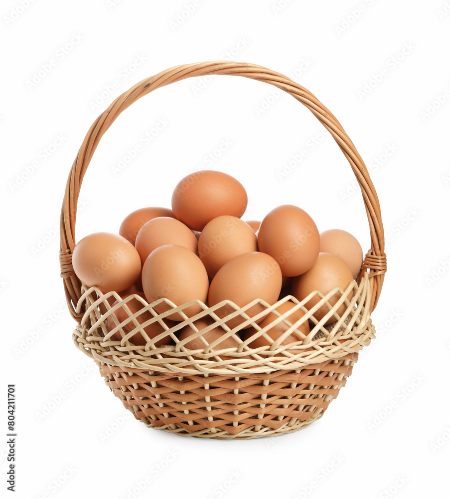 Chicken eggs in wicker basket isolated on white Chicken eggs in wicker basket isolated on white