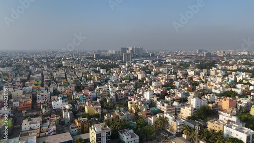 A dynamic drone footage capturing the essence of Chennai's urban landscape, from the busy city under a cloudy sky. photo