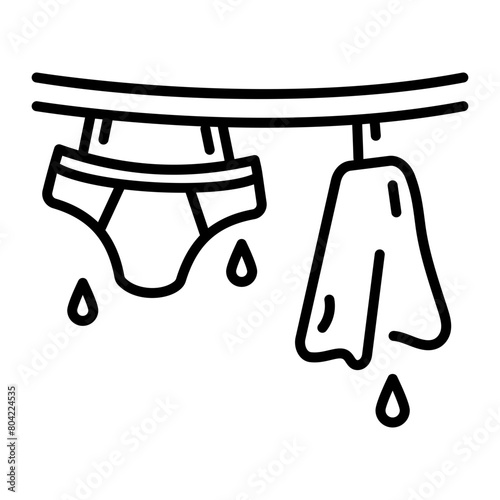 Get this linear icon of drying clothes 