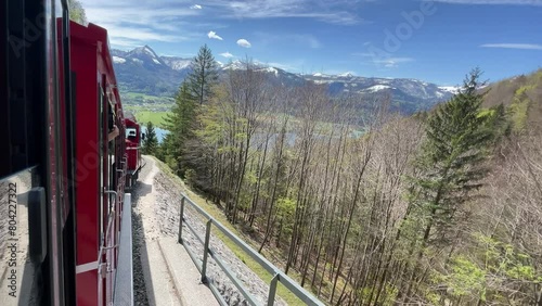 incredible view from alp mountain schafsberg on lake wolfgangsee in Austria filmed out of red cog cable railway. Summer, sunny weather. Tourism of Salzkammergut. Nature. photo