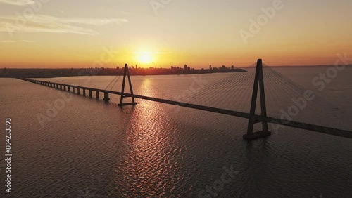 The sun sets in the middle of the San Roque González de Santa Cruz International Bridge.
Bridge connecting the city of Posadas, Argentina with the city of Encarnación, Paraguay photo