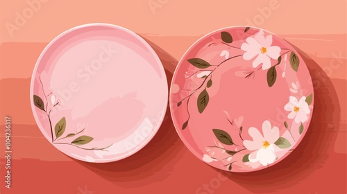 Clean ceramic plates and floral decor on pink woode