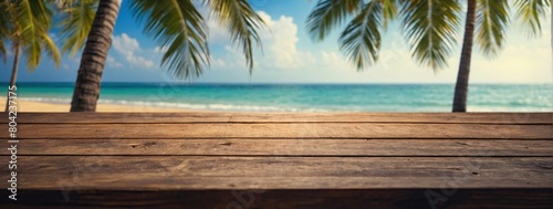 Top of wood table with seascape and palm leaves  blur bokeh light of calm sea and sky at tropical beach background  Empty ready for your product display montage  summer vacation background concept