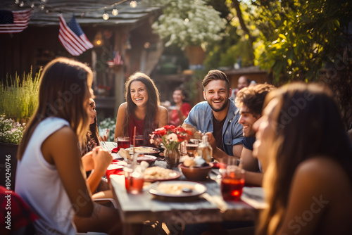 Multi-generation family having dinner outdoors on an American national holiday