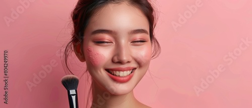 The beauty of a multicultural Asian brunette using a blushing makeup brush in a wellness, cosmetics, spa and natural skincare concept on an isolated background with soft colors.