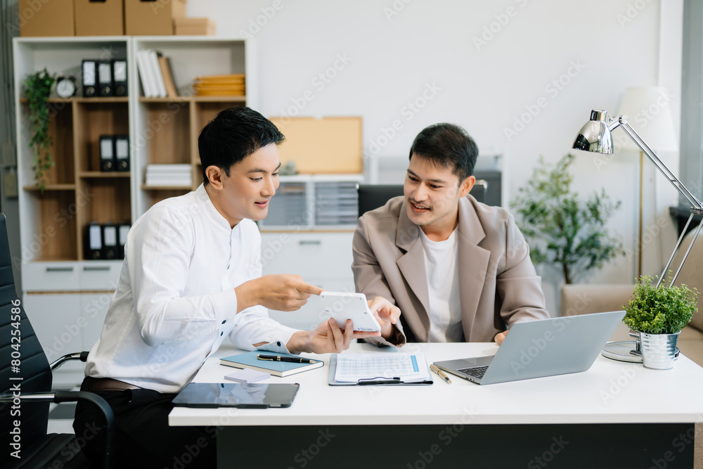Kind leader executive manager share and discuss business solutions plan ideas on tablet Kind leader executive manager share and discuss business solutions plan ideas on tablet