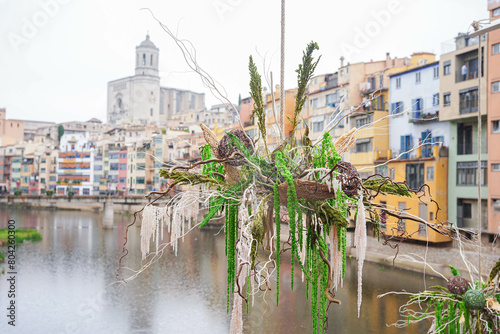 view of the flowers in the city of Girona with the colorful houses next to the river. Flower festival photo