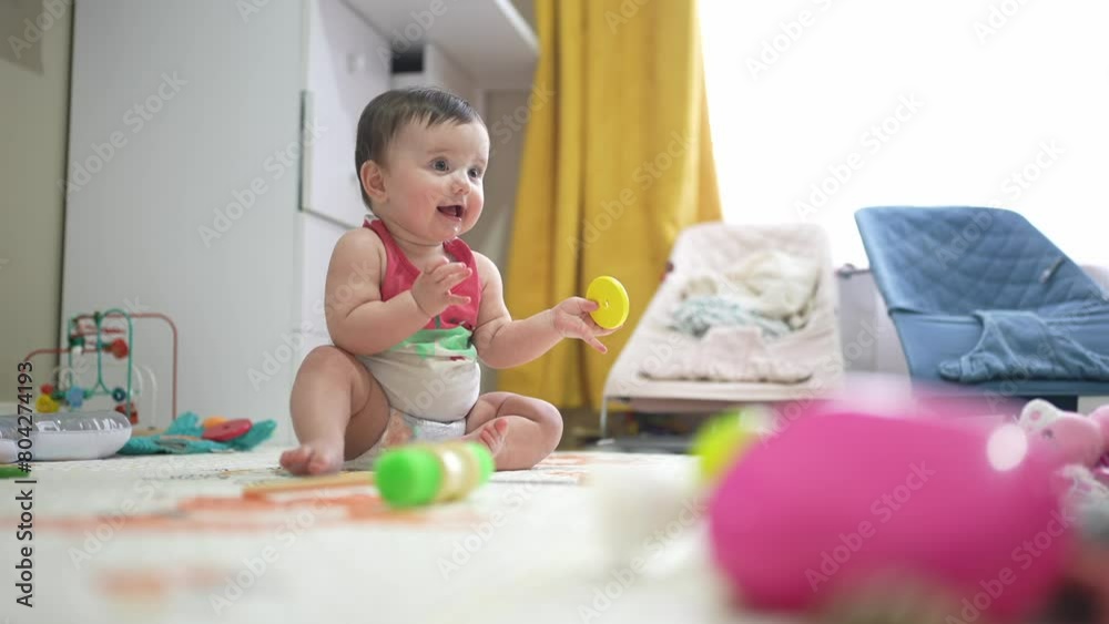baby plays toys floor. happy family kid dream concept. baby sits on the floor playing. baby playing at home indoors sitting on the floor light from the window lifestyle baby plays toys floor. happy family kid dream concept. baby sits on the floor playing. baby playing at home indoors sitting on the floor light from the window lifestyle