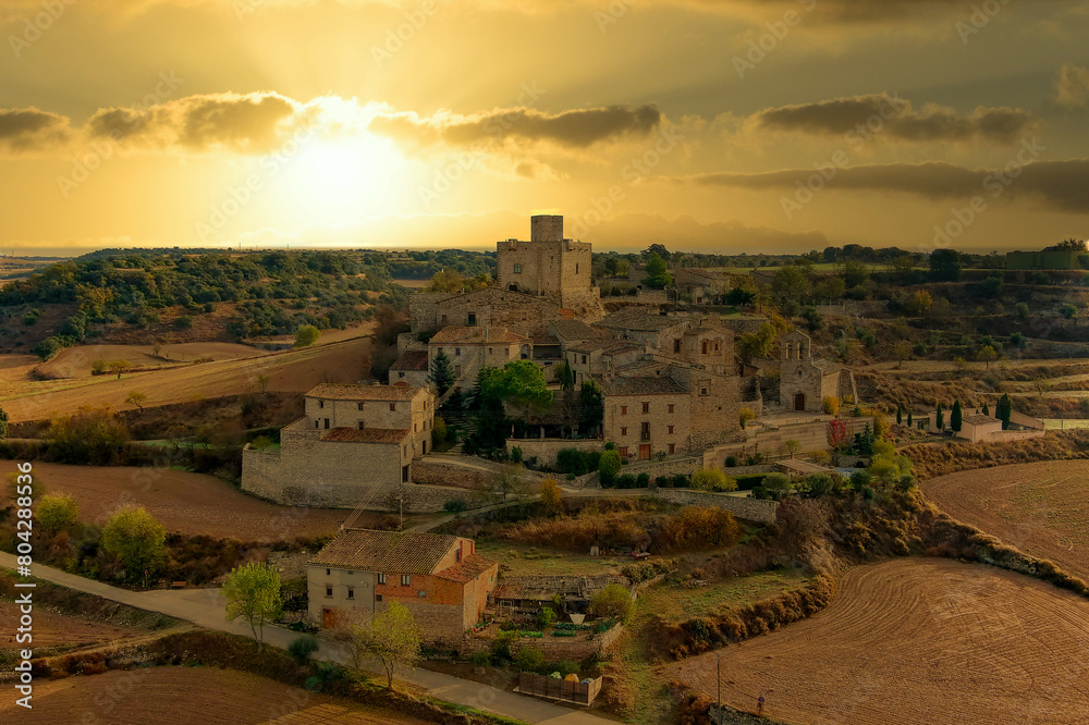Sunset Over Historic Village in Lleida with Picturesque Countryside