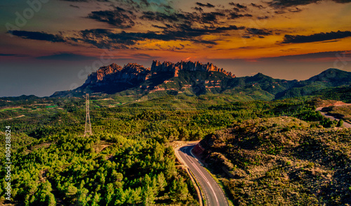 Canvas Print Dramatic Sunset Over Montserrat Viewed from the Forest of Crosses, Barcelona