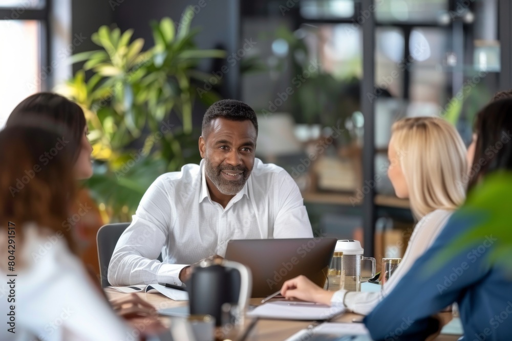 Businessman having meeting with colleagues at office Businessman having meeting with colleagues at office