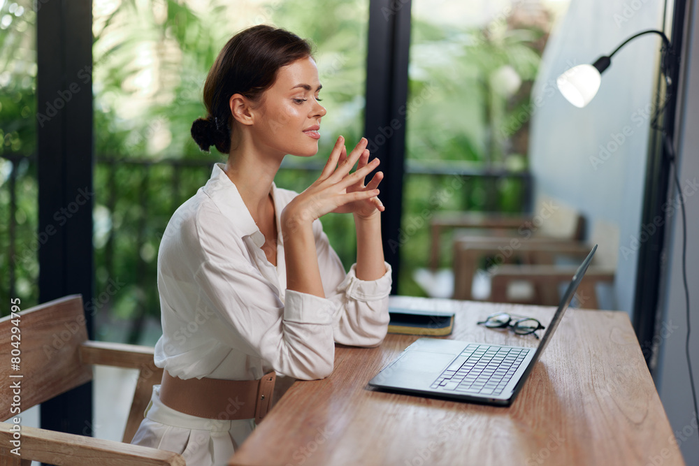 custom made wallpaper toronto digitalHappy Freelancer Woman Working from Home with Laptop in a Summery Balistyle Indoor Workplace