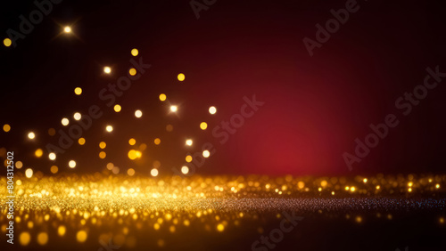 Christmas and New Year winter holiday background. Scattering of golden particles on dark vinous blurred bokeh festive background with copy space for text.