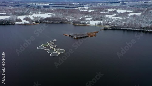 Aerial Symphony. Snow Kissed Fish Cages in Winter Quietude. Aerial drone shot