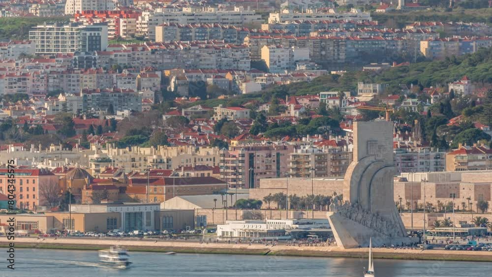 Padrao dos Descobrimentos or Monument to the Discoveries aerial timelapse located on the waterfront on northern bank of the Tagus River in Lisbon, Portugal. City panorama with typical houses