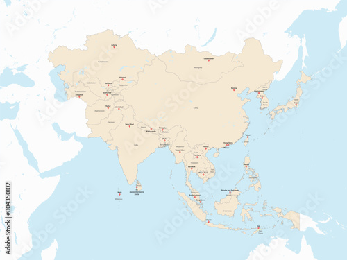 Light red detailed political map of ASIA with country and capital cities name tags using orthographic projection on white and blue background