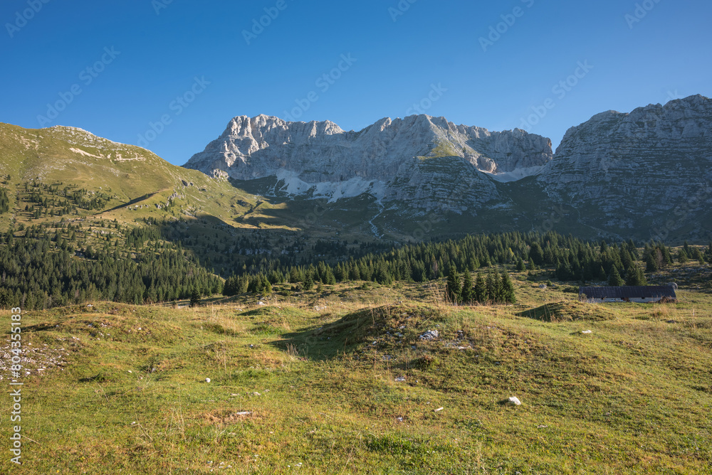 Mountain landscape Pecol in Italy, monumental gorges and its surroundings on a summer day. Travel, nature, and tourism concepts.