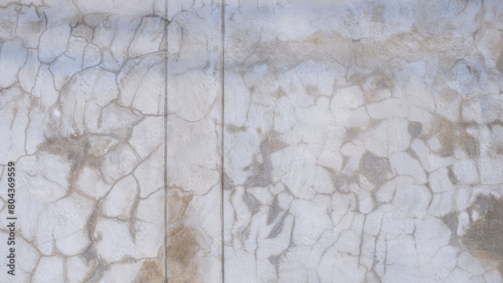 Naklejka premium The old grunge concrete fence wall background with many crack lines texture and stains on surface