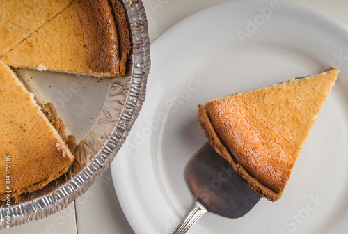 Cheese Cake or Cheese Pie slice on a white plate photo