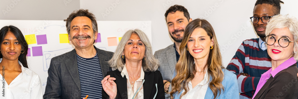 Multi ethnic people of different age looking at camera in office horizontal banner - multiracial business people group smiling faces headshot portraits - Wide panoramic header design. Multi ethnic people of different age looking at camera in office horizontal banner - multiracial business people group smiling faces headshot portraits - Wide panoramic header design.