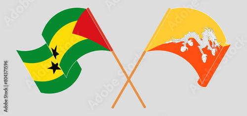 Crossed and waving flags of Sao Tome and Principe and Bhutan