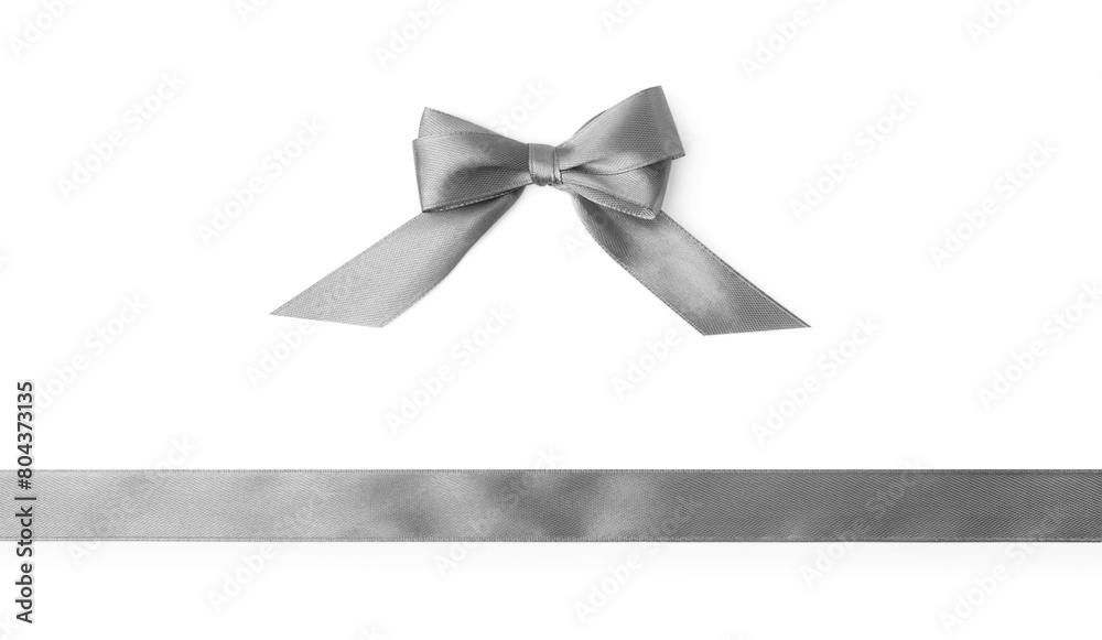 Grey satin ribbon and bow on white background, top view Grey satin ribbon and bow on white background, top view
