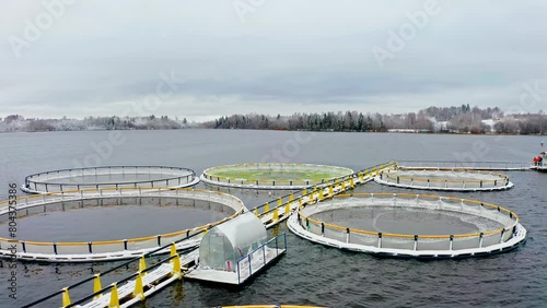 Organic Aquaculture Unveiled: Snow-Adorned Salmon and Trout Farms. Aerial drone shot