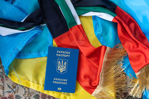 Kiev, Ukraine - 16.04.2022: passport of Ukraine, flag of Ukraine and UAE photo