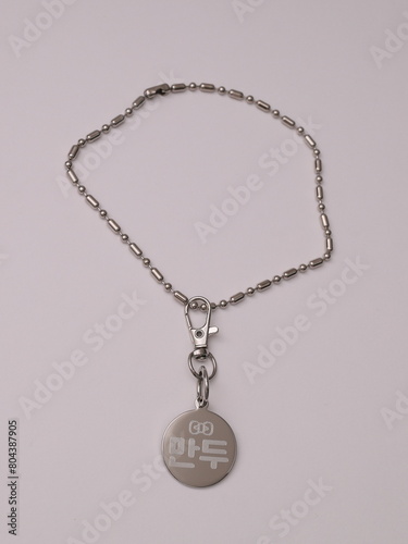 a cat and dog's name tag necklace
