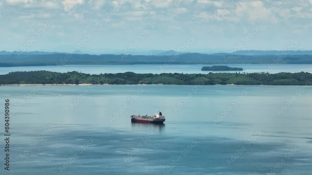 Bay with ship and coast of the island of Borneo. Sandakan, Sabah, Malaysia. Bay with ship and coast of the island of Borneo. Sandakan, Sabah, Malaysia.
