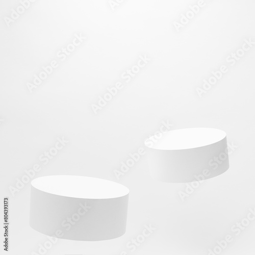 Set of two tilt round white podiums mockup for cosmetic products, levitate on white background. Scene for presentation products, gifts, goods, advertising, sale, showing, design in modern style.