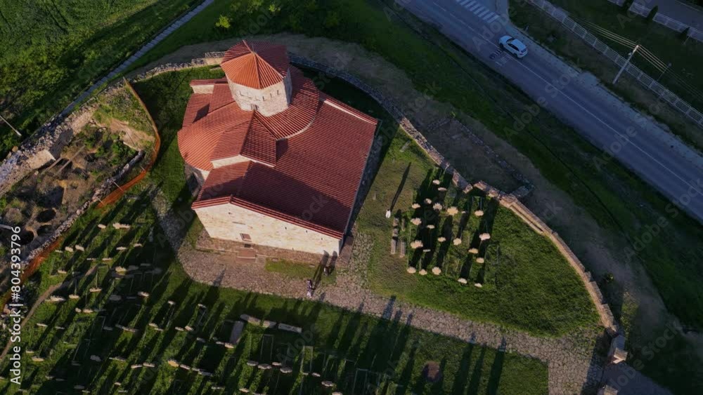 Aerial view of Serbian Orthodox Church of the Holy Apostles Peter and Paul, Ras and gravestones.The oldest church in Serbia. Novi pazar, Serbia 29.04.2024 