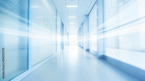 Empty white corridor with glass walls. Blurred motion image in blue and white tones. Medical facility concept. Design for healthcare posters and presentations. Wide angle perspective with copy space.