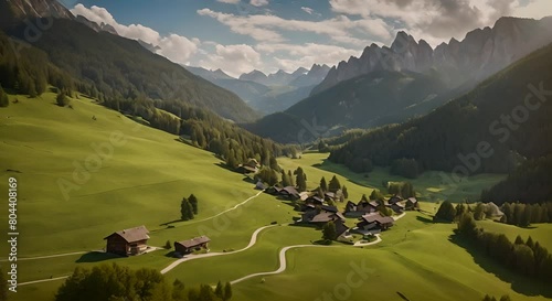 Aerial cinematic footage of the lush green meadows of Pralongia in the Italian Dolomites Drone is flying forward revealing old cottages and winding unpaved roads and paths LuPa Creative photo