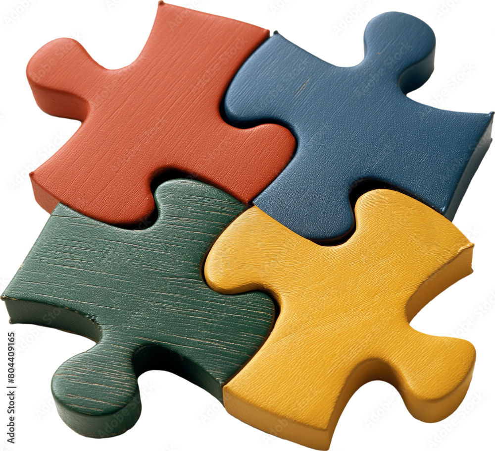 Obraz premium Four plain-colored wooden jigsaw pieces are arranged together.