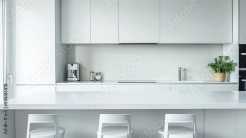 White Modern Kitchen Interior with Sink, Cabinets and Hardwood Floor in New Luxury Home