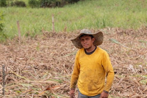 lifestyle: latino farmer is sweating in his farm field