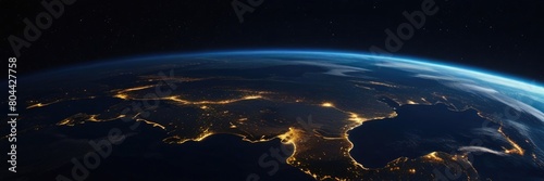 Planet Earth at night in outer space. Surface of the Earth. Sunrise view of the planet Earth from space with the sun setting over the horizon