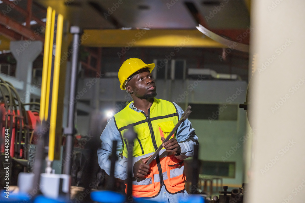 Black man factory worker working in metal sheet manufacturing industrial Black man factory worker working in metal sheet manufacturing industrial