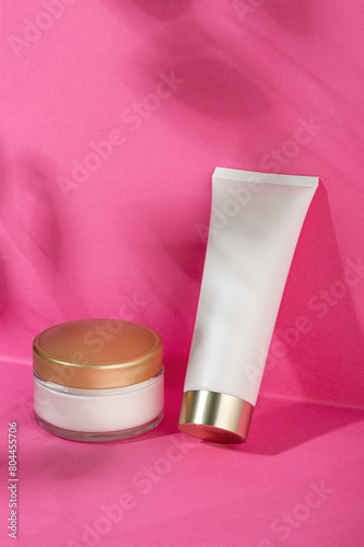 Cosmetic product for face and body on pink background