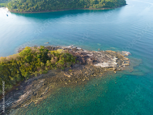 Aerial drone view of beautiful rocky with turquoise sea water and trees of Gulf of Thailand. Kood island, Thailand.