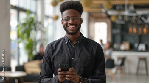 Smiling Man with Smartphone Indoors